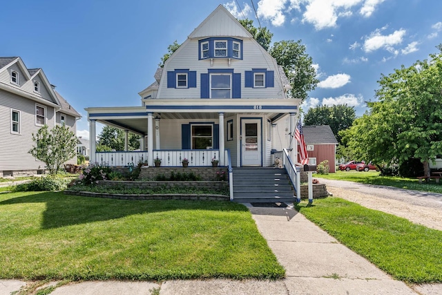 818 N State St, Belvidere, IL 61008 - view of front of property featuring a porch, a front lawn, and a gambrel roof