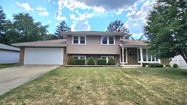 611 Kungs Way, Joliet, IL 60435 - tri-level home with a garage, concrete driveway, a front yard, a chimney, and brick siding