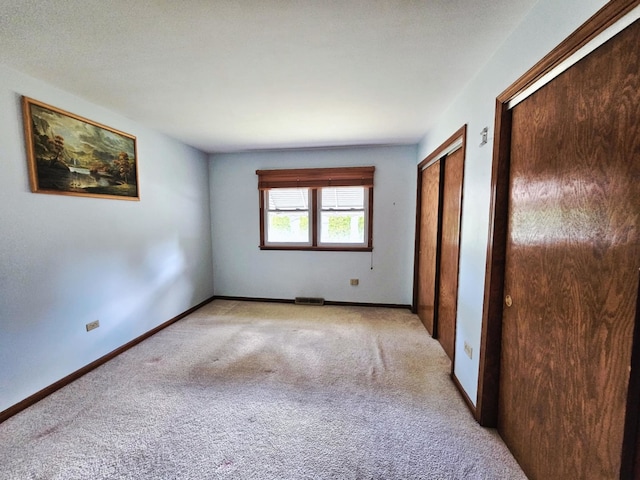611 Kungs Way, Joliet, IL 60435 - unfurnished bedroom with two closets and carpet flooring