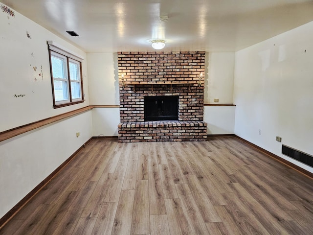 611 Kungs Way, Joliet, IL 60435 - unfurnished living room with wood finished floors and a fireplace