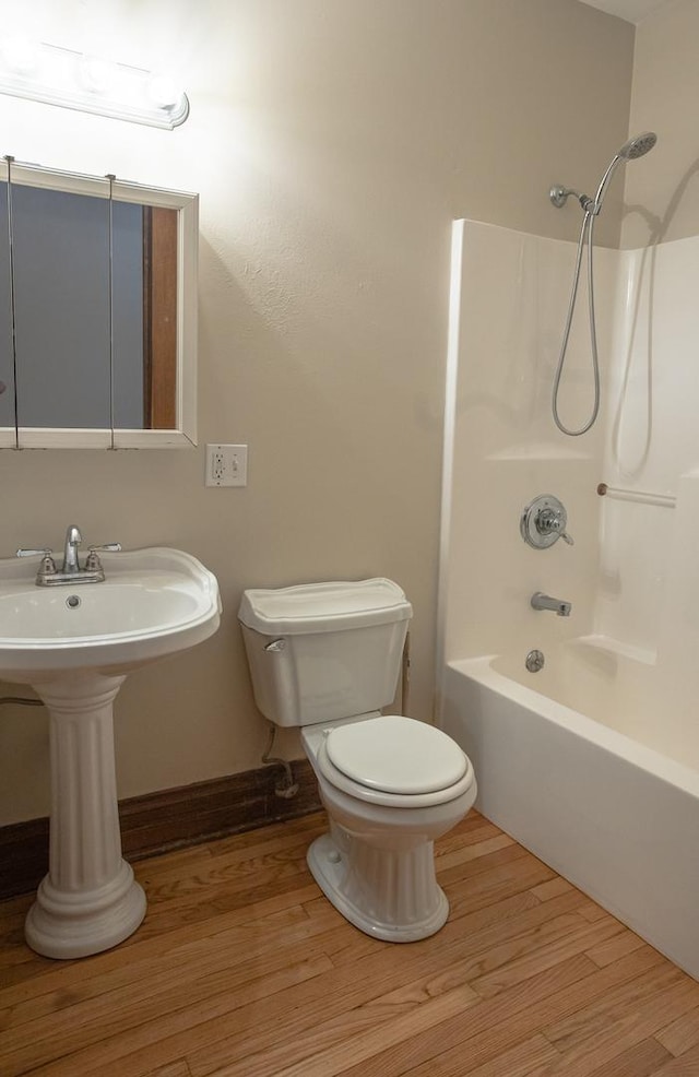 224 N Maple St, Gilman, IL 60938 - full bathroom with bathing tub / shower combination and wood finished floors