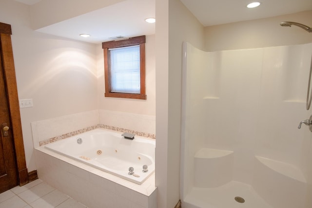224 N Maple St, Gilman, IL 60938 - bathroom with a whirlpool tub, tile patterned flooring, a shower, and recessed lighting