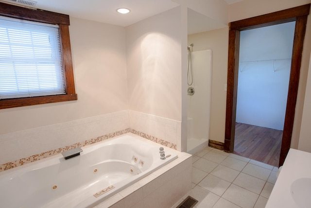 224 N Maple St, Gilman, IL 60938 - full bath with a jetted tub, walk in shower, tile patterned floors, and a spacious closet