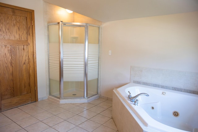 224 N Maple St, Gilman, IL 60938 - full bath with a shower stall, a jetted tub, and tile patterned flooring
