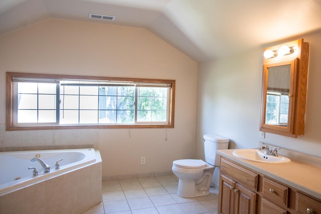 224 N Maple St, Gilman, IL 60938 - full bathroom featuring a tub with jets, vanity, vaulted ceiling, and tile patterned floors