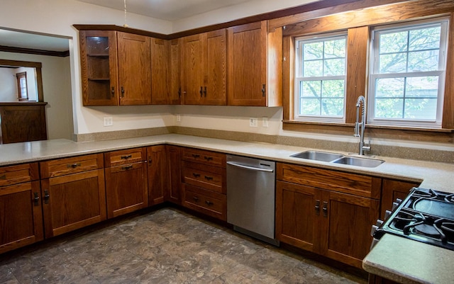 224 N Maple St, Gilman, IL 60938 - kitchen featuring dishwasher, light countertops, brown cabinets, range, and crown molding