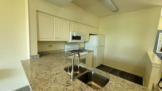 17885 W Salisbury Dr, Gurnee, IL 60031 - kitchen with white appliances, light stone counters, white cabinets, and dark wood-type flooring