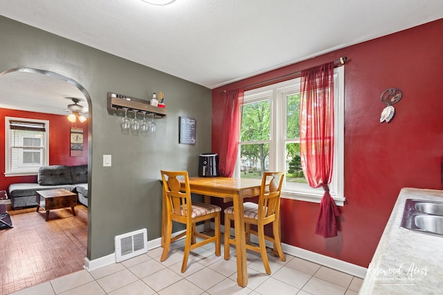 382 N 8th Ave, Kankakee, IL 60901 - dining space with arched walkways and ceiling fan