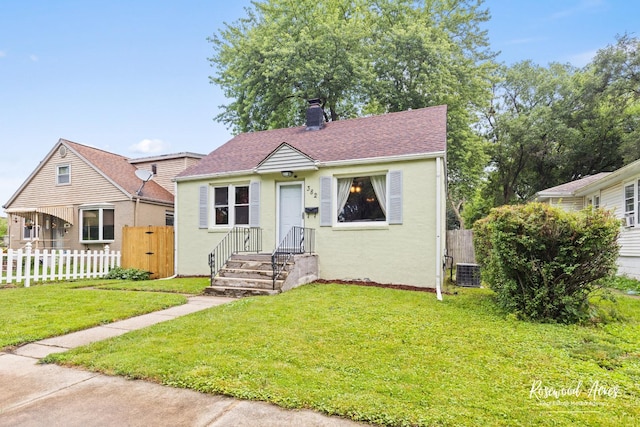382 N 8th Ave, Kankakee, IL 60901 - bungalow-style house with a chimney, stucco siding, and roof with shingles