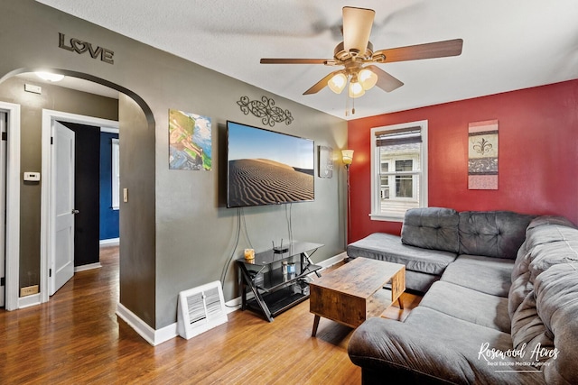 382 N 8th Ave, Kankakee, IL 60901 - living room with arched walkways, ceiling fan, and wood finished floors