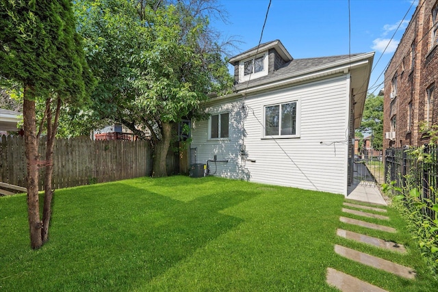 back of property with a shingled roof