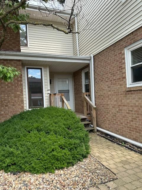 903 N Linden St Unit 3, Normal, IL 61761 - doorway to property with brick siding