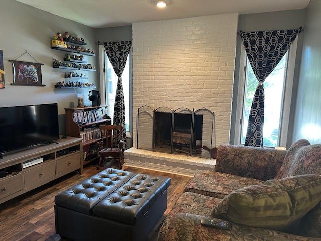 903 N Linden St Unit 3, Normal, IL 61761 - living area featuring dark wood-style flooring and a brick fireplace