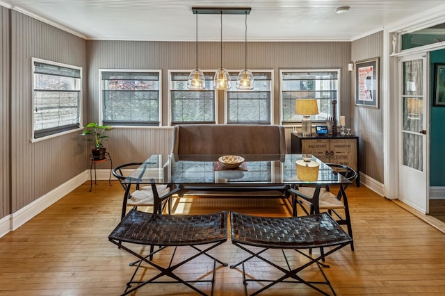 1422 Wesley Ave, Evanston, IL 60201 - dining room featuring ornamental molding, breakfast area, hardwood / wood-style floors, and plenty of natural light