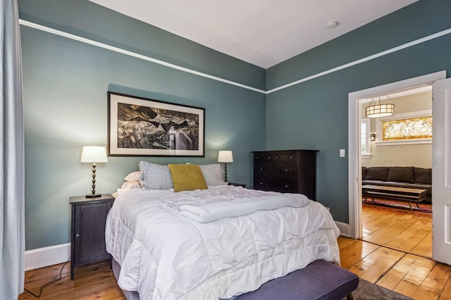 1422 Wesley Ave, Evanston, IL 60201 - bedroom featuring hardwood / wood-style floors and baseboards