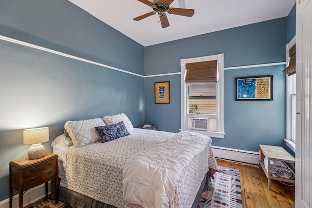 1422 Wesley Ave, Evanston, IL 60201 - bedroom with baseboard heating, wood-type flooring, a ceiling fan, and cooling unit