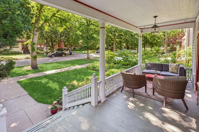 1422 Wesley Ave, Evanston, IL 60201 - wooden porch featuring an outdoor living space and a lawn