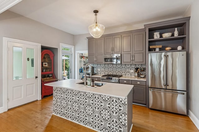 1422 Wesley Ave, Evanston, IL 60201 - kitchen with stainless steel appliances, light countertops, light wood-style flooring, and open shelves