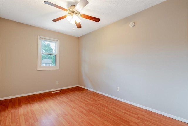 6 Starlight Ct, Bloomington, IL 61704 - spare room featuring light wood-style flooring, a smoke detector, and ceiling fan
