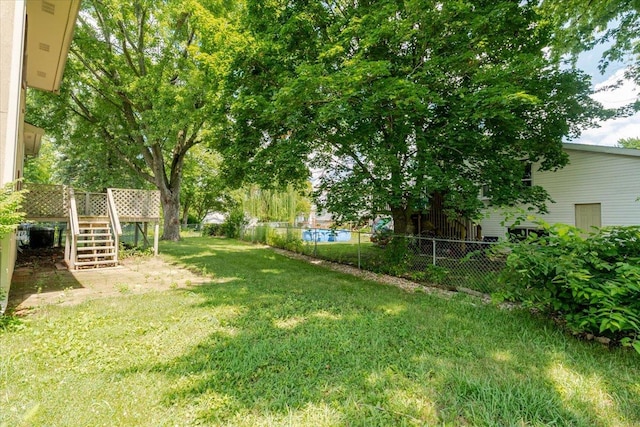 6 Starlight Ct, Bloomington, IL 61704 - fenced backyard featuring stairway and a wooden deck