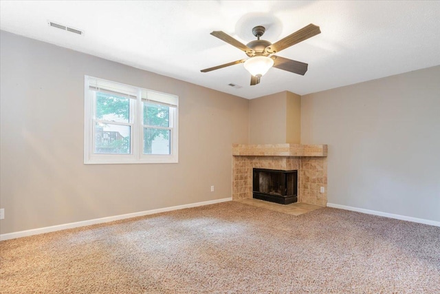 6 Starlight Ct, Bloomington, IL 61704 - unfurnished living room with a fireplace, carpet flooring, and a ceiling fan