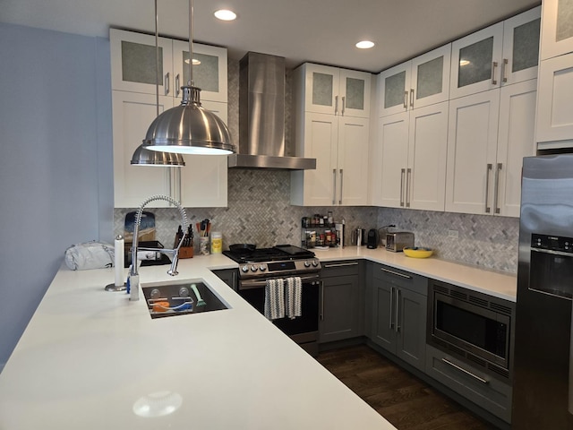 2744 N Lincoln Ave Unit 2, Chicago, IL 60614 - kitchen with appliances with stainless steel finishes, wall chimney range hood, light countertops, decorative backsplash, and recessed lighting