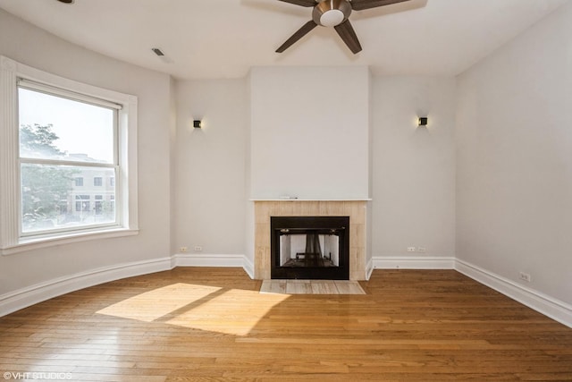 3252 S Prairie Ave Unit 2S, Chicago, IL 60616 - unfurnished living room with ceiling fan, wood finished floors, and a fireplace