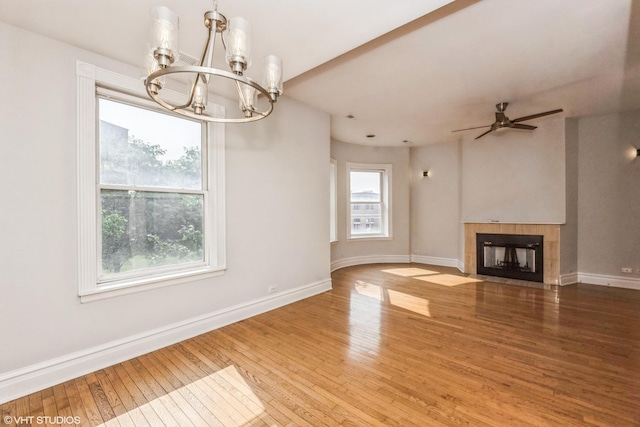 3252 S Prairie Ave Unit 2S, Chicago, IL 60616 - unfurnished living room featuring a chandelier, wood-type flooring, a fireplace, and a ceiling fan