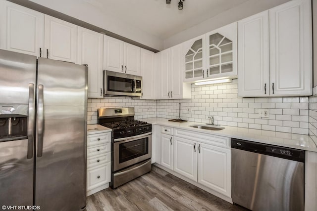 3252 S Prairie Ave Unit 2S, Chicago, IL 60616 - kitchen featuring appliances with stainless steel finishes, light countertops, and white cabinetry