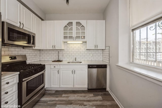 3252 S Prairie Ave Unit 2S, Chicago, IL 60616 - kitchen with stainless steel appliances, dark wood finished floors, white cabinets, and light countertops