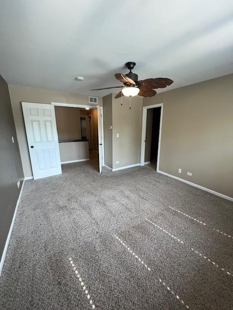 372 S Crown Ct, Palatine, IL 60074 - carpeted spare room with baseboards and ceiling fan
