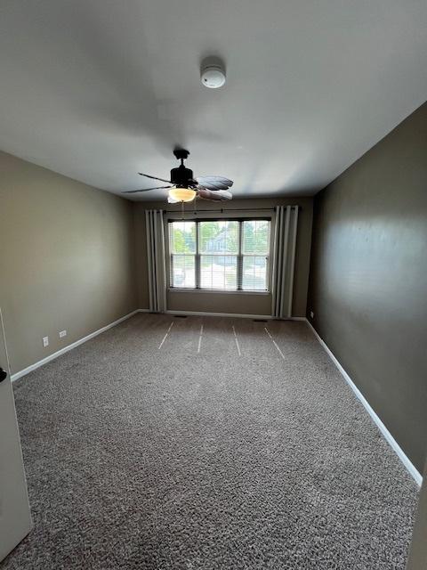 372 S Crown Ct, Palatine, IL 60074 - spare room with a ceiling fan and carpet