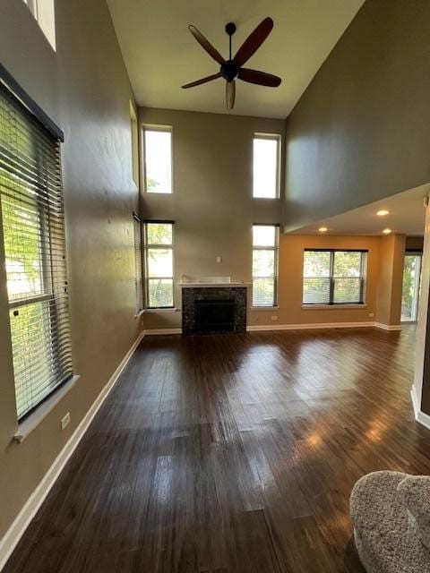 372 S Crown Ct, Palatine, IL 60074 - unfurnished living room with high vaulted ceiling, a fireplace, ceiling fan, and wood finished floors