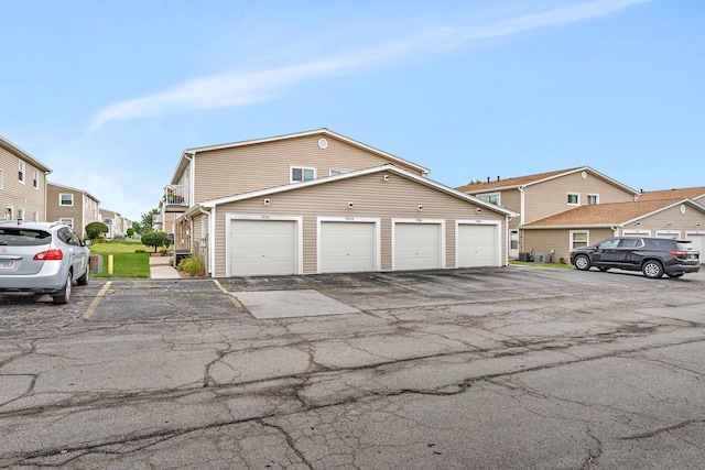 7926 164th Pl Unit 7926, Tinley Park, IL 60477 - view of front of home with community garages and a residential view