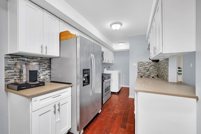 7926 164th Pl Unit 7926, Tinley Park, IL 60477 - kitchen featuring appliances with stainless steel finishes, dark wood-type flooring, white cabinets, decorative backsplash, and independent washer and dryer