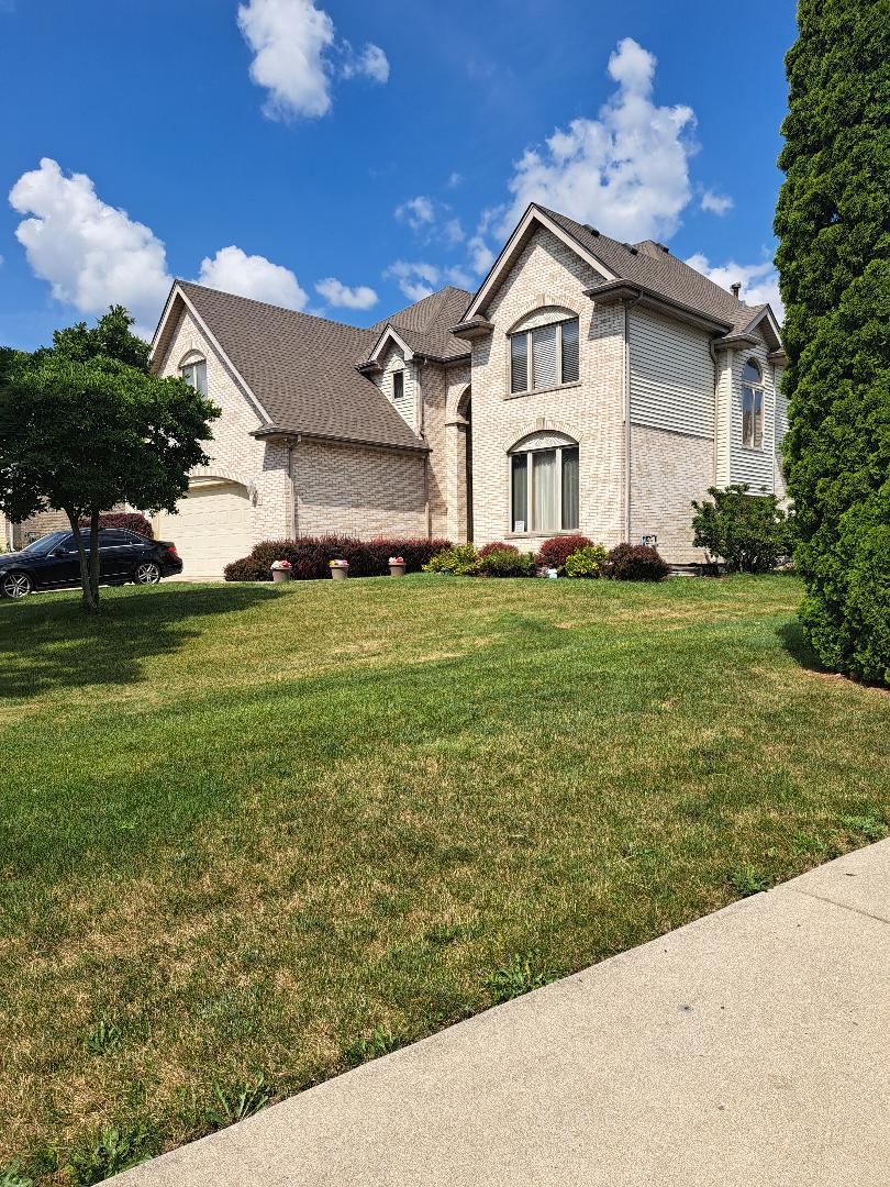 3806 Carrington Dr, Hazel Crest, IL 60429 - french country home with a front lawn and brick siding