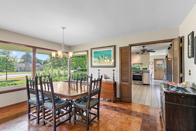 306 Wing Park Blvd, Elgin, IL 60123 - dining area featuring healthy amount of natural light, a chandelier, and a ceiling fan