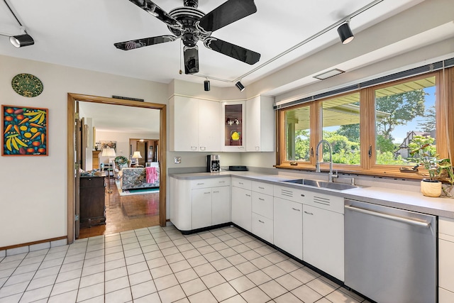 306 Wing Park Blvd, Elgin, IL 60123 - kitchen with stainless steel dishwasher, light countertops, white cabinetry, ceiling fan, and rail lighting