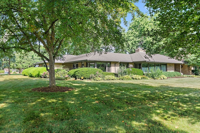 306 Wing Park Blvd, Elgin, IL 60123 - ranch-style home with a front yard and a chimney