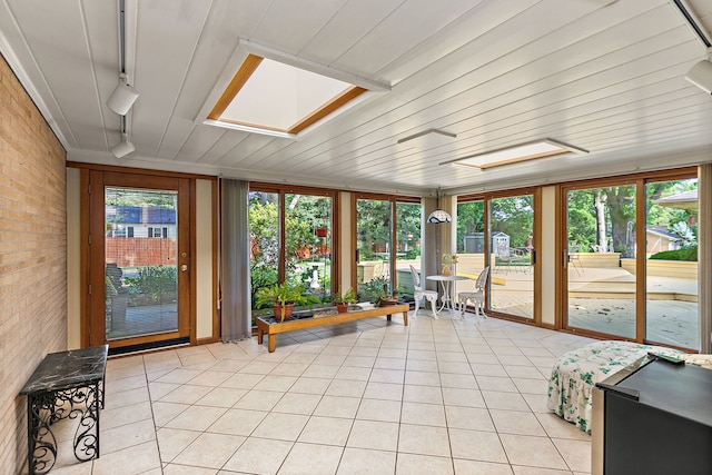 306 Wing Park Blvd, Elgin, IL 60123 - sunroom / solarium with brick wall, tile patterned floors, rail lighting, and a skylight