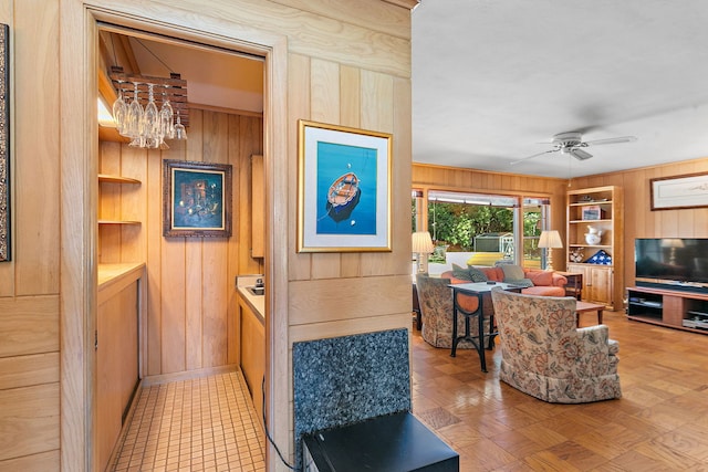 306 Wing Park Blvd, Elgin, IL 60123 - living area featuring wooden walls, a chandelier, a ceiling fan, and built in shelves