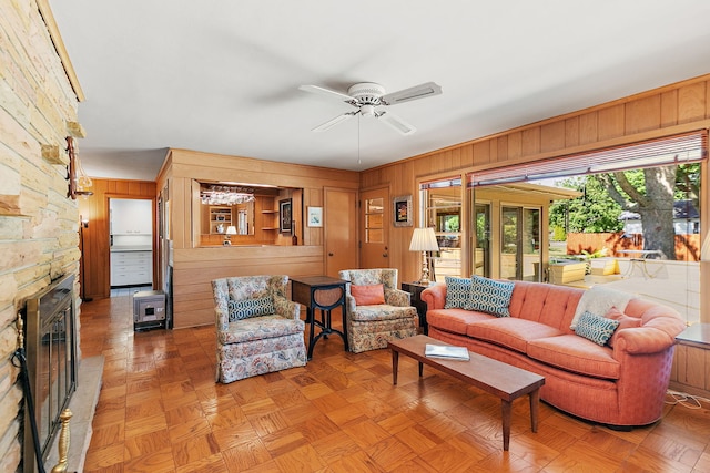 306 Wing Park Blvd, Elgin, IL 60123 - living room with wooden walls, a ceiling fan, and a fireplace