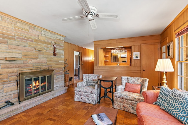306 Wing Park Blvd, Elgin, IL 60123 - living area with wood walls, a ceiling fan, and a fireplace