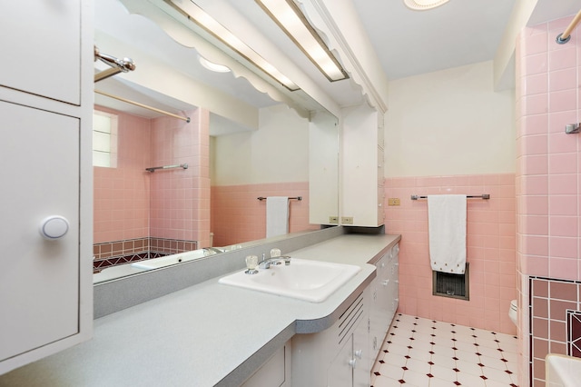 306 Wing Park Blvd, Elgin, IL 60123 - full bath featuring tile walls, vanity, a shower, and a wainscoted wall