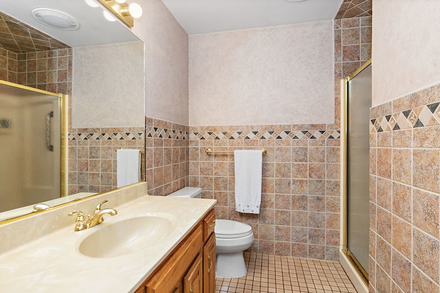 306 Wing Park Blvd, Elgin, IL 60123 - full bathroom featuring tile walls, a stall shower, vanity, tile patterned floors, and a wainscoted wall