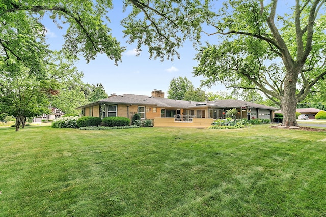 306 Wing Park Blvd, Elgin, IL 60123 - rear view of property featuring a chimney, a yard, and brick siding