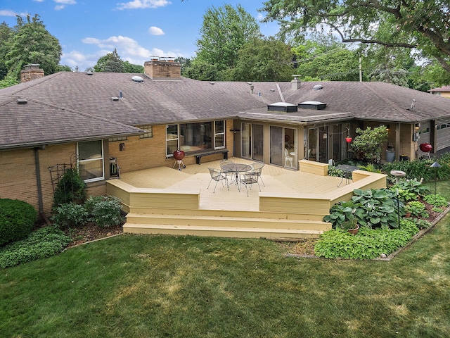 306 Wing Park Blvd, Elgin, IL 60123 - rear view of property with a chimney, brick siding, a yard, and a sunroom