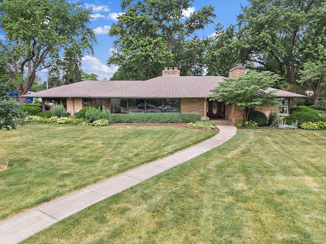 306 Wing Park Blvd, Elgin, IL 60123 - single story home featuring a front yard and a chimney