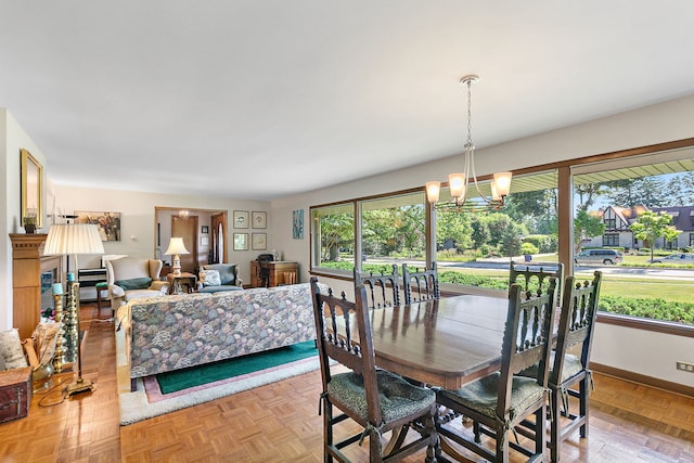 306 Wing Park Blvd, Elgin, IL 60123 - dining area featuring a chandelier and baseboards