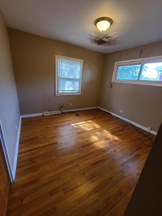 15408 Dobson Ave, Dolton, IL 60419 - spare room featuring wood finished floors and baseboards